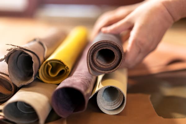 A close-up of a collection of rolled leather upholstery